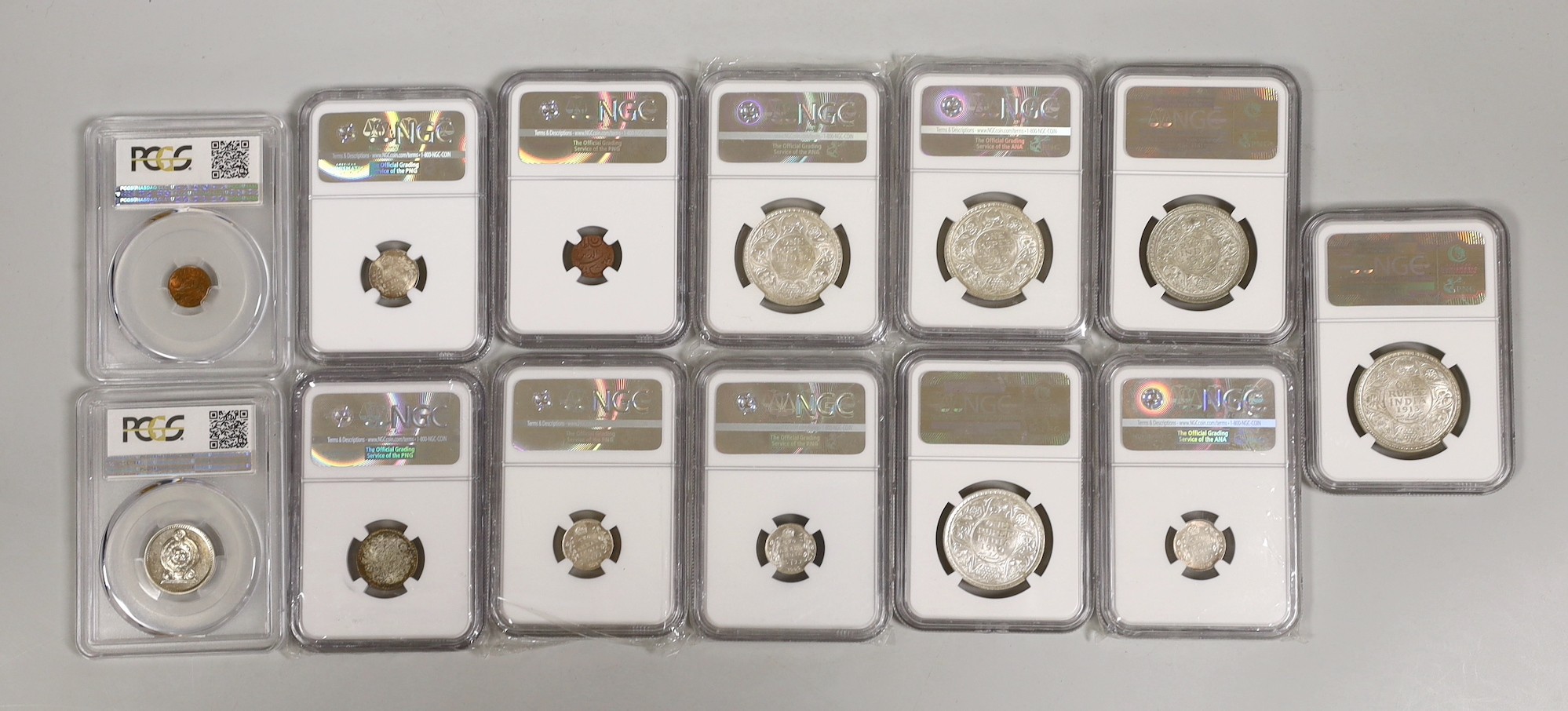 British India coins, NGC slabbed and graded - 1 rupee 1943 B, type D/4 six leaf lotus, AU58, four 1 rupee 1913 B, 3 x 1919 B, four 2 annas, 3 x 1906 C and 1905 C and a quarter rupee 1942 C together with PCGS and NGS slab